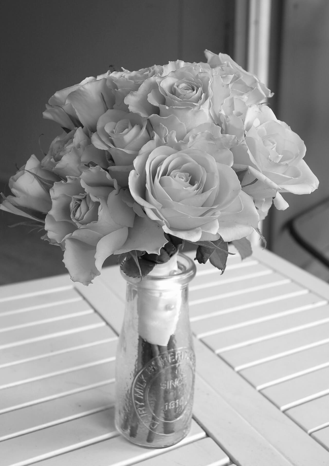 Black and white roses in vase